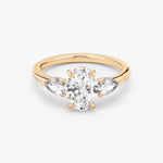 Load image into Gallery viewer, Oval Cut - Plain Band - Three Stone Ring - 0.25 Ct Side Stone each - 14 K Gold
