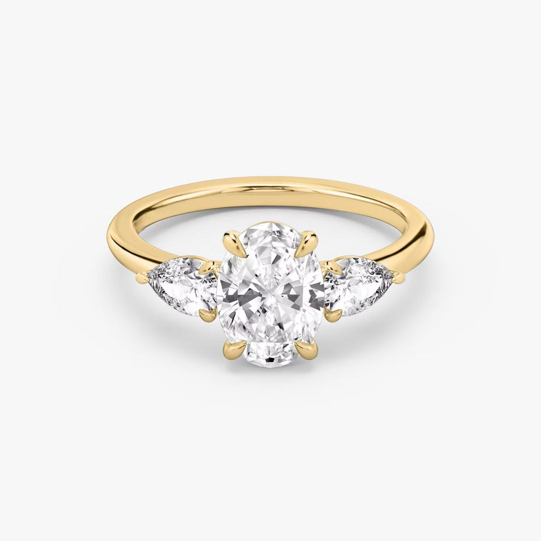 Oval Cut - Plain Band - Three Stone Ring - 0.25 Ct Side Stone each - 18 K Gold