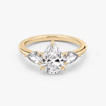 Load image into Gallery viewer, Pear Cut - Plain Band - Three Stone Ring - 0.25 Ct Side Stone each - 14 K Gold
