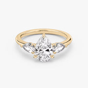 Pear Cut - Plain Band - Three Stone Ring - 0.25 Ct Side Stone each - 14 K Gold