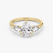 Pear Cut - Plain Band - Three Stone Ring - 0.25 Ct Side Stone each - 14 K Gold
