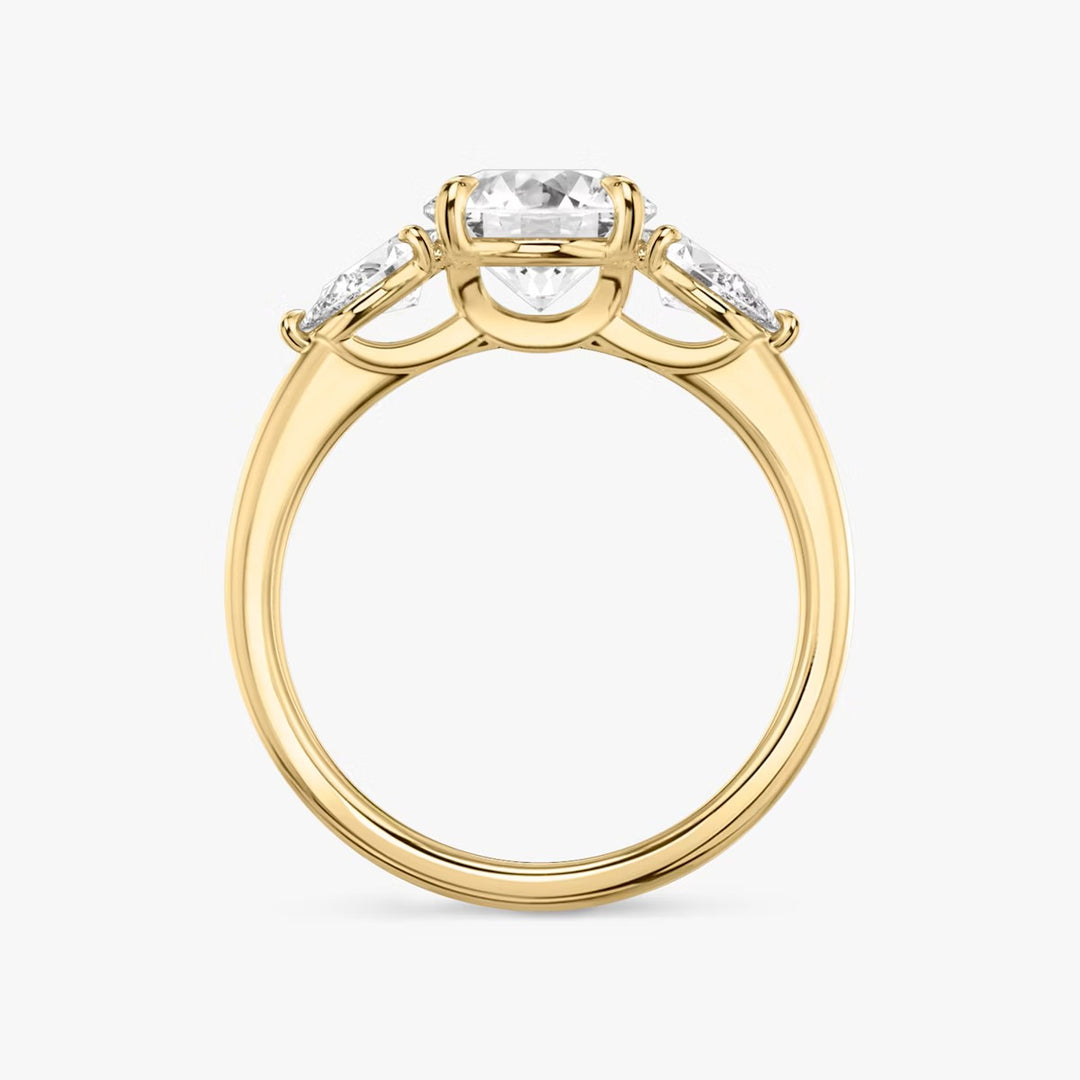 Round Cut - Plain Band - Three Stone Ring - 0.25 Ct Side Stone each - 18 K Gold