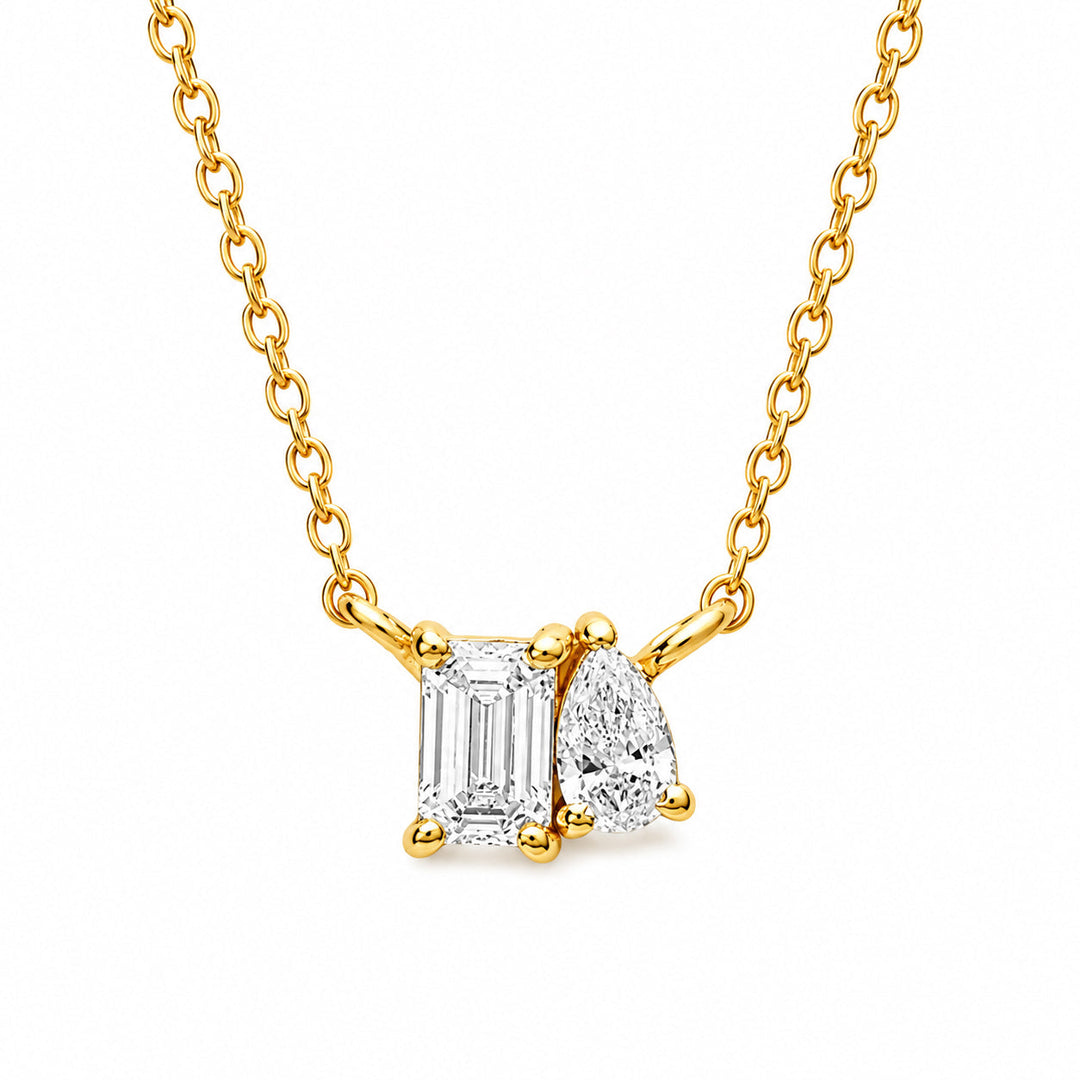 Emerald cut and pear cut lab grown diamond toi et moi necklace in yellow gold vermeil